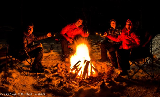 around a campfire in the winter