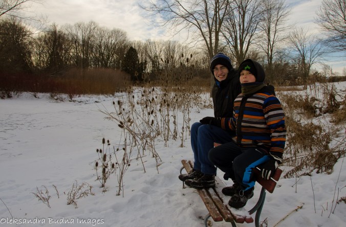 kids by a frozen river