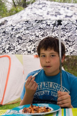 eating breakfast under an umbrella