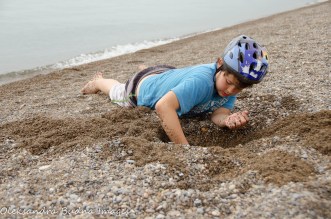 digging at the beach at Point Pelee National Park