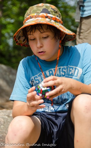 doing Rubik's Cube during a rest stop on the trail