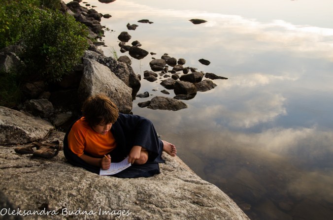 reading by the lake at Quetico Provincial Park