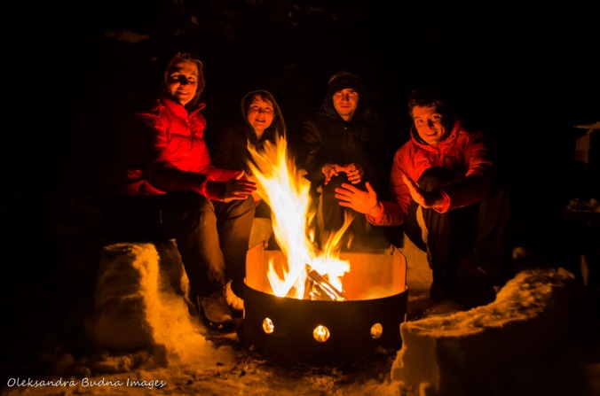 around a campfire in Killarney in the winter