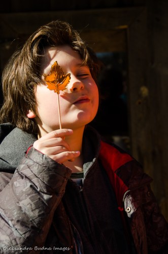 child holding a maple syrop lollypop