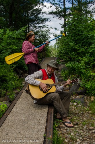 playing the guitar on old marine railway on portage from Balsam to Three-mile lake