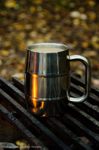 cup of coffee near the campfire