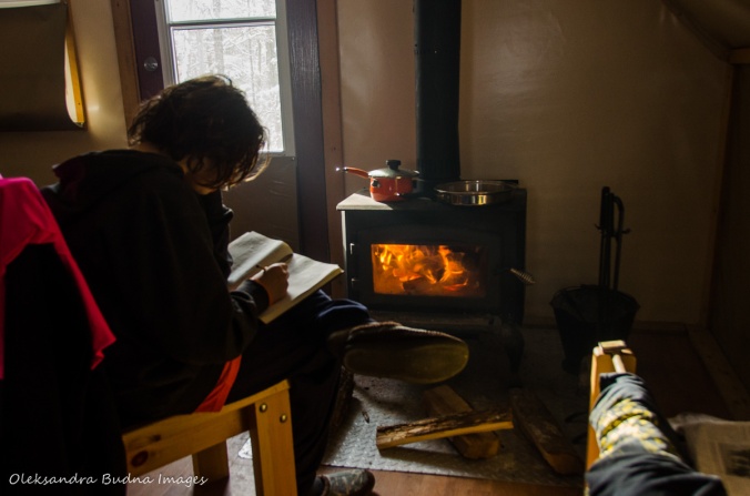 in front of a wood stove at four-seasons tent in Gatineau Park