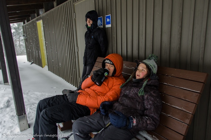 taking a break near a comfort station in Gatineau Park in the winter