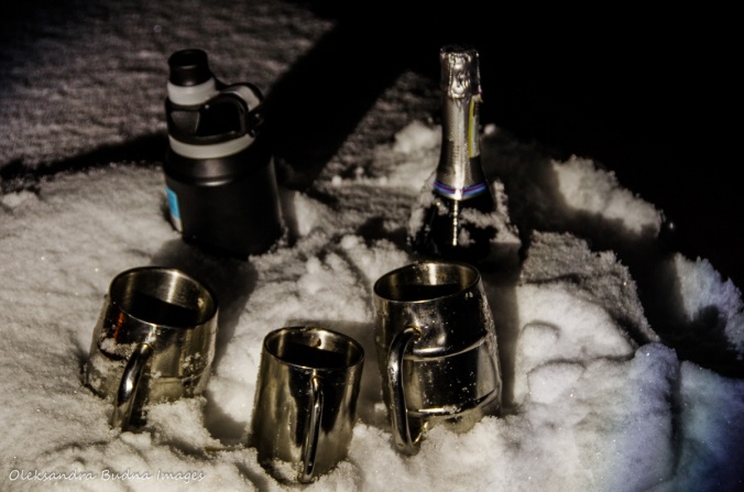 champaign and campign mugs in the snow