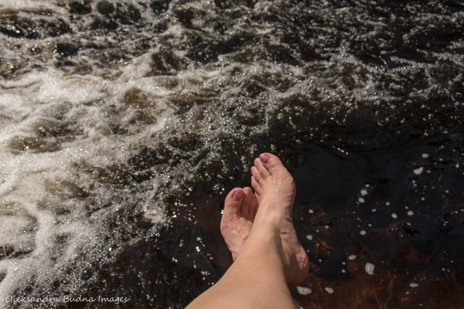 cooling my feet in Madawaska River falls in Algonquin