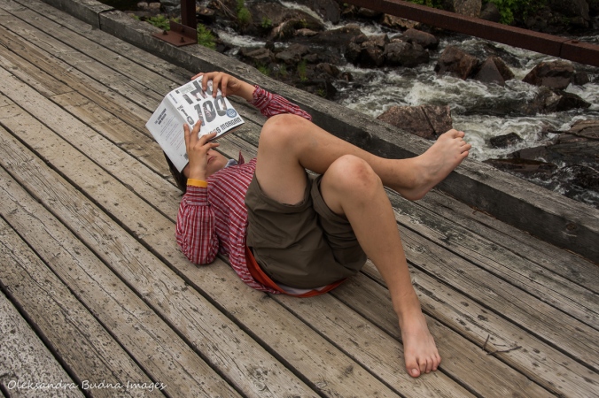 reading a book during a portage at Point Grondine park