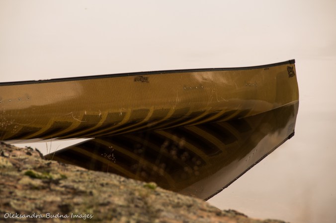 canoe with reflection in the water