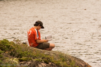 reading at a campsite