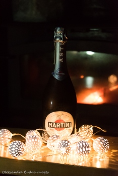champaign with christmas lights and fire in the background