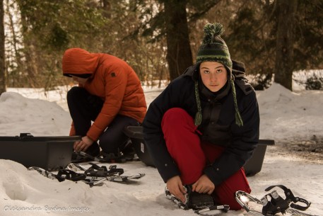 putting on snowshoes