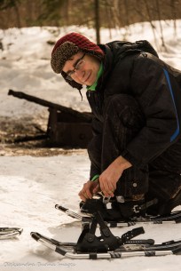 putting on snowshoes