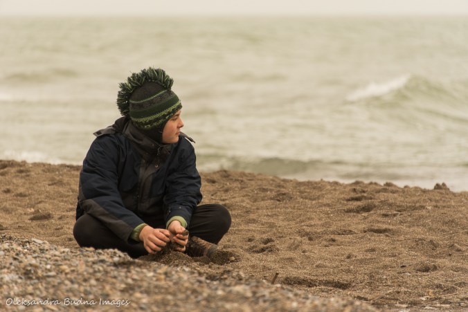 child sitting on a beach