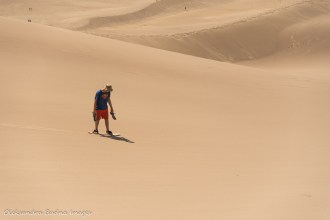 sandboarding at Great Sand Dunes National Park in Colorado