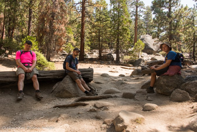 taking a break while hiking Half Dome tril in Yosemite