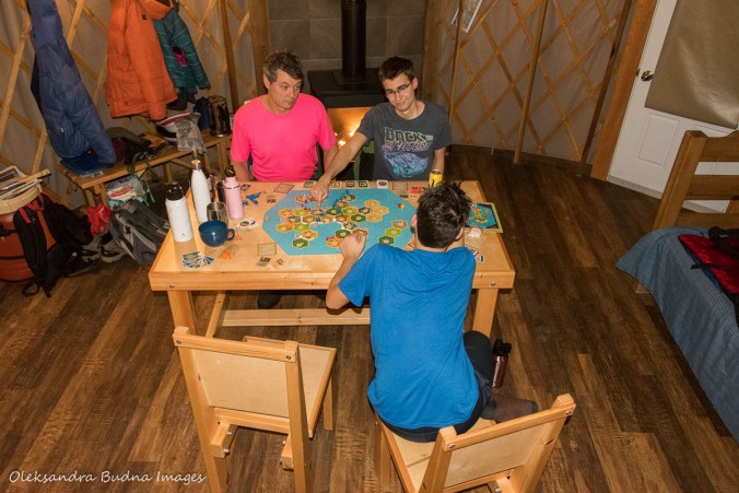 playing a board game inside yurt 46 at MacGregor Point