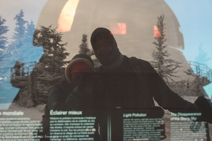 taking a photo of a reflection in the information panel at Mont-Mégantic observatory