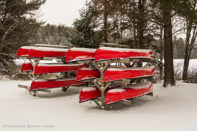 canoes on a rack at silent lake provincial park in the winter