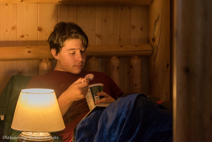 reading a book in a cabin at Windy Lake