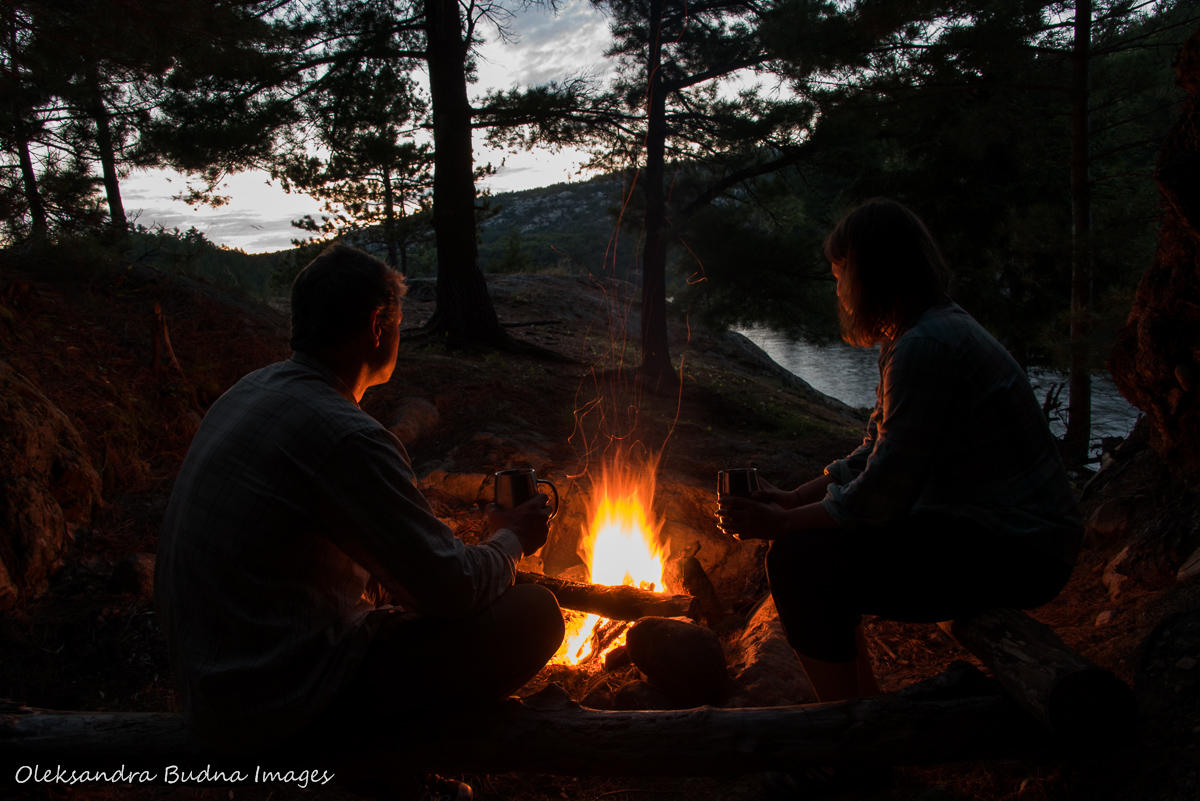 sitting by the campfire at campsite 52 on Three Narrows Lake in Killarney