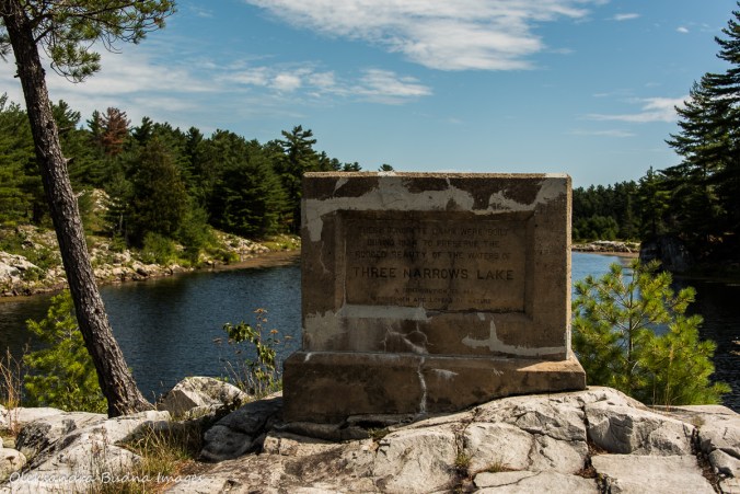 stone commemorating building dams on Three Narrows Lake in Killarney 