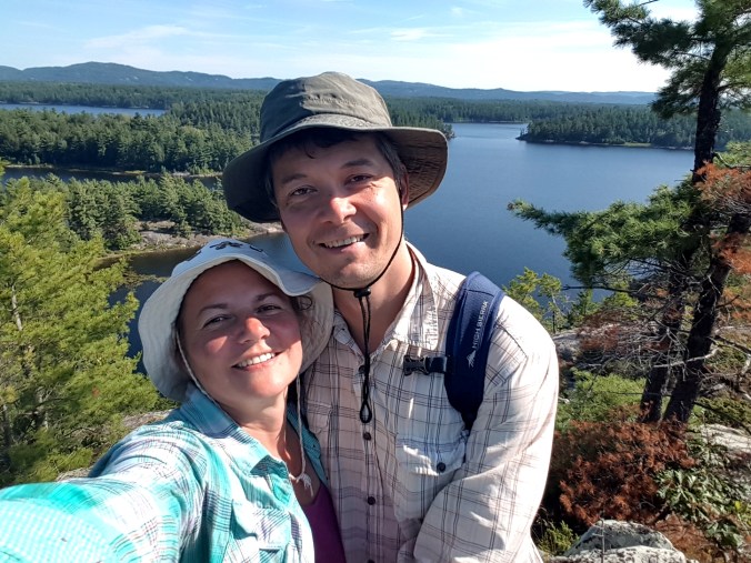 selfie from the cliff with Three Narrows Lake in the background 
