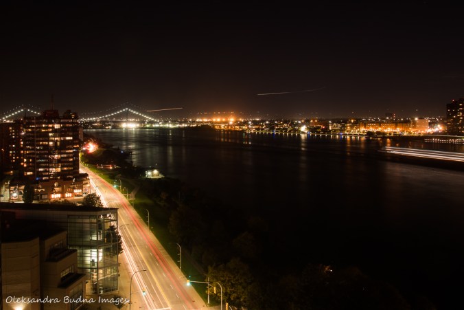 view of Detroit river and Ambassador Bridge at night